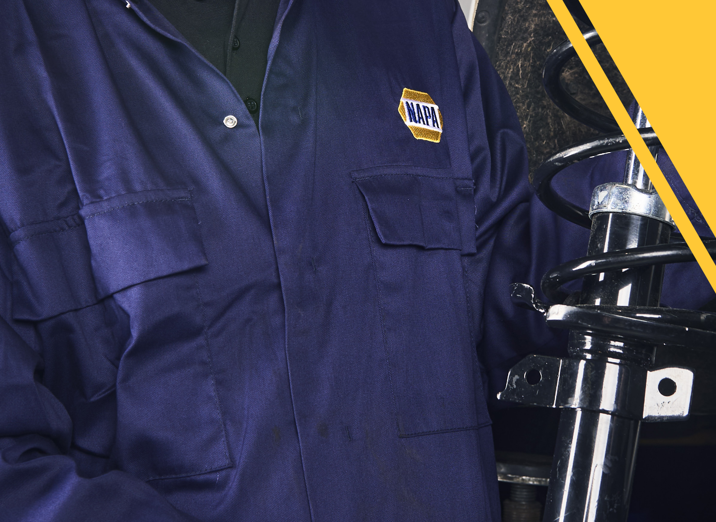 Mechanic in NAPA overalls